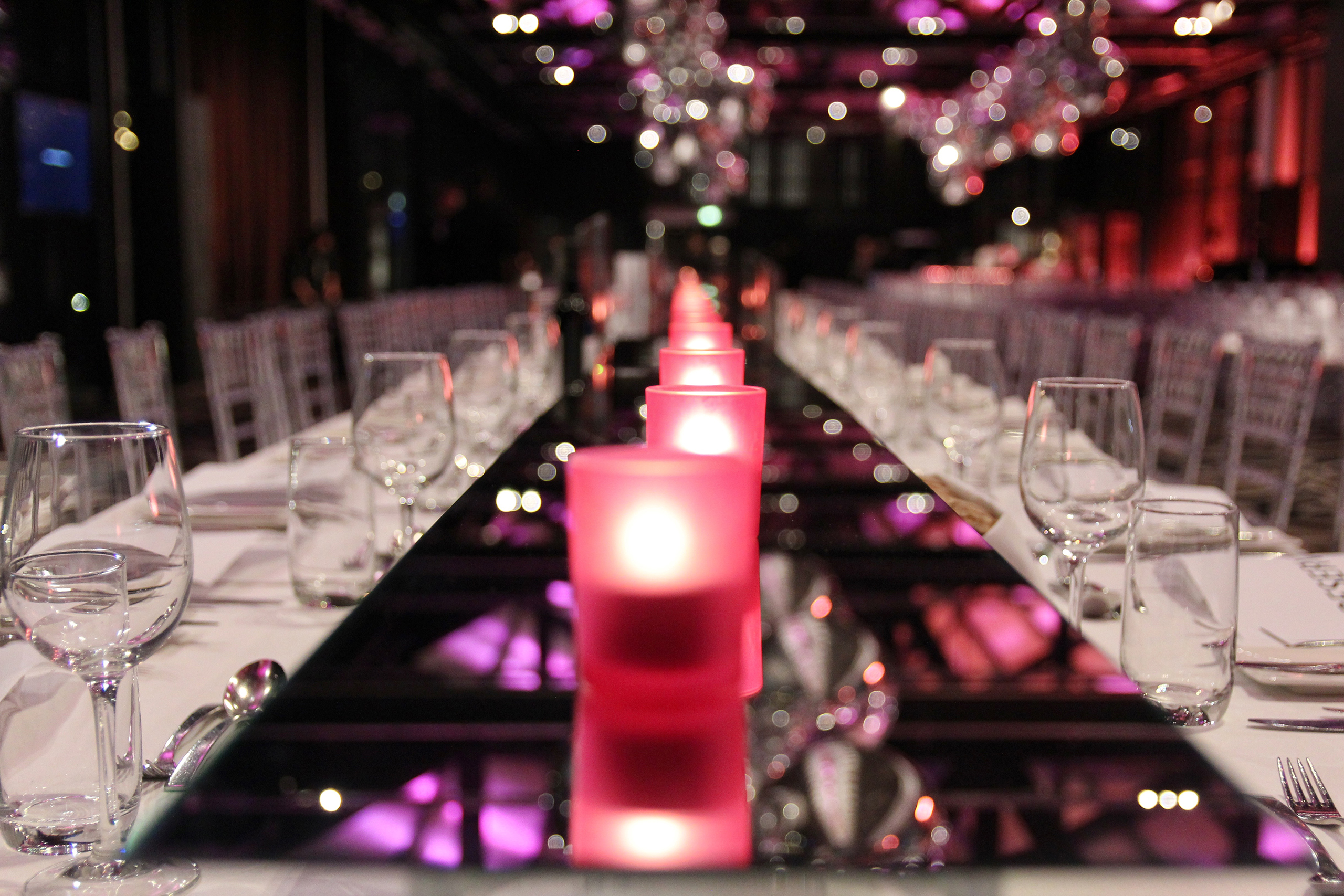 Table setting with pink votives